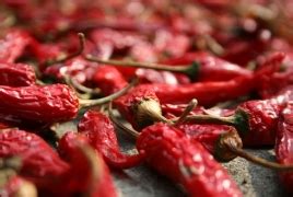 Eating chilies cuts risk of death from heart attack and stroke .